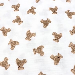 May include: White fabric with a repeating pattern of brown teddy bears.