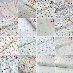 Op de afbeelding: Een collectie van zestien stofstalen met diverse patronen, waaronder hartjes, regenbogen, kronen, dieren en bloemmotieven op een witte achtergrond, elk gemarkeerd met een rood nummer van 33 tot 48 voor identificatiedoeleinden.