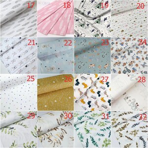 May include: A collection of 12 different fabric swatches with various patterns, including feathers, stars, animals, and leaves. The swatches are numbered 17 through 32.
