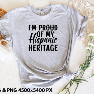May include: A gray t-shirt with the text "I'm Proud of My Hispanic Heritage" printed in black.