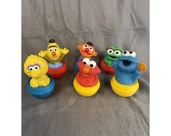 Set de 6 Weebles Wobble de Barrio Sésamo: Monstruo de las Galletas, Big Bird, Oscar, Elmo y Ernie.