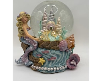Globo de agua con forma de sirena de San Francisco Music Box que reproduce "All I Ask of You".