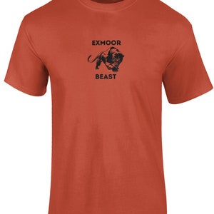 May include: A rust-colored t-shirt with a black panther graphic and the text "Exmoor Beast" printed on the front.