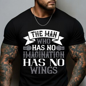 May include: Black t-shirt with the text "THE MAN WHO HAS NO IMAGINATION HAS NO WINGS" in white and gray. The shirt has a crew neck and short sleeves. The design includes boxing gloves.