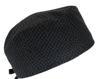May include: Black scrub hat with a gray patterned design. The hat has a tie at the back.