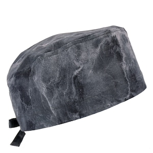 May include: A gray and white patterned scrub cap with a tie at the back.