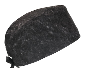 May include: A black scrub cap with a gray marble pattern. The cap has a tie at the back.