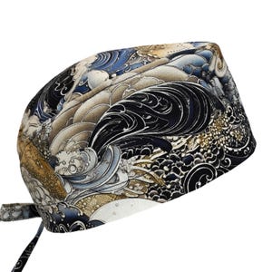 May include: A patterned surgical scrub cap featuring a wave design in shades of blue, black, tan, and white. The cap has a tie closure at the back and is designed to cover the head and secure hair during medical procedures.