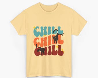 May include: A light yellow t-shirt with the word "CHILL" in teal, orange, and maroon, with black cat illustrations. The word "CHILL" is repeated three times, with star accents.