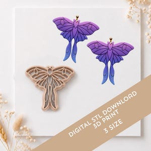 May include: Two moth-shaped earrings with a purple to blue gradient and gold-toned posts, alongside a beige plastic moth-shaped cookie cutter. The image includes the text: DIGITAL STL DOWNLOAD 3D PRINT 3 SIZE.