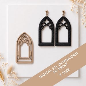 May include: A pair of black gothic arch-shaped earrings with gold-toned hardware and a matching beige plastic cutter. The text on the image reads DIGITAL STL DOWNLOAD 3D PRINT 3 SIZE. The items are displayed on a white surface with dried flowers.