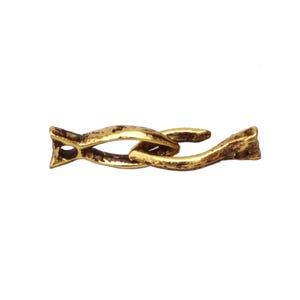 May include: A gold-colored metal chain link with a textured, aged appearance. The link is composed of two intertwined sections, each with a decorative, pointed end. The overall design suggests a vintage or antique aesthetic.