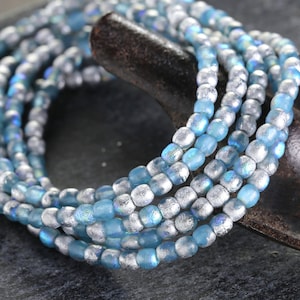 Czech Glass 3mm Round Druk - Textured Aquamarine AB w/ Silver