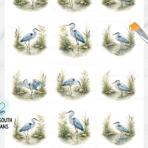 May include: Decoupage rice paper sheet with watercolour illustrations of blue herons in a marsh. The herons are shown in different poses amongst reeds and water plants. The text "Down South Artisans" and "heron3-2.2in" are also visible.