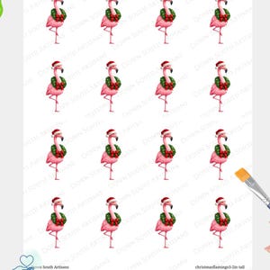 May include: A sheet of decoupage rice paper featuring sixteen repeating illustrations of a pink flamingo wearing a red and white Santa hat and a green Christmas wreath with a red bow around its neck. The text Down South Artisans is visible.