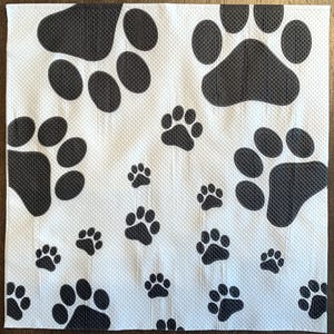 May include: White background with a repeating pattern of black paw prints of varying sizes.