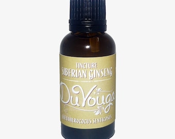 Puede incluir: Una botella de vidrio marrón con tapa negra, etiquetada "Tincture Siberian Ginseng DuYouga". La etiqueta tiene un fondo beige con letras blancas y doradas. La botella contiene un líquido, y la estética general es natural y herbal.