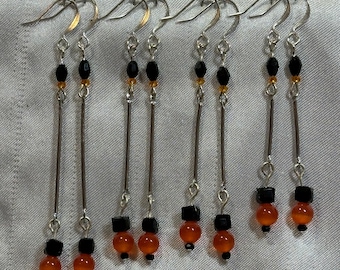 Silver, black and orange graduated lengths dangle earrings - cats eye & crystals