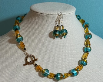 Focal Closure with Peace Statement glass and gold 20 inch necklace with matching earrings