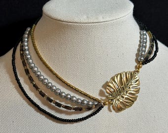 Gold Leaf Focal Necklace in black, gray and gold with 4 strands and matching earrings