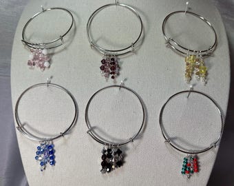 Wire Bracelet with dangling crystals and beads.  Sliding bangle style.