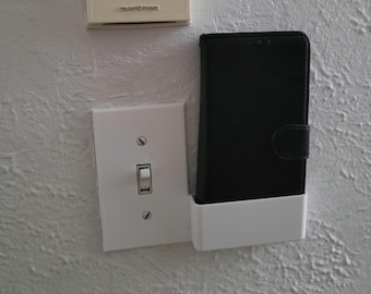 Wall switch plate phone holder dock digital download. 3D print STEP/STL file for standard switch plate with cellphone storage. Pocket 4&quot;x1&quot;