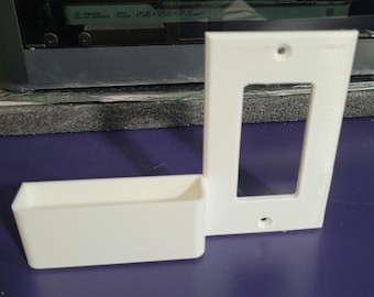 Wall plate phone holder charging dock digital download. 3D print STEP/STL file for Leviton type switch plate w integrated cellphone storage.