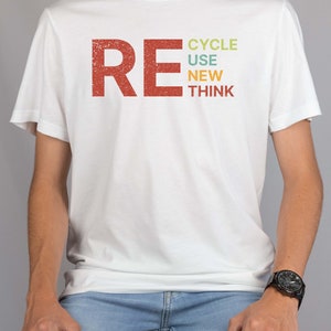 May include: A white t-shirt with a red, orange, yellow, green, and blue graphic that says "RECYCLE USE NEW THINK".