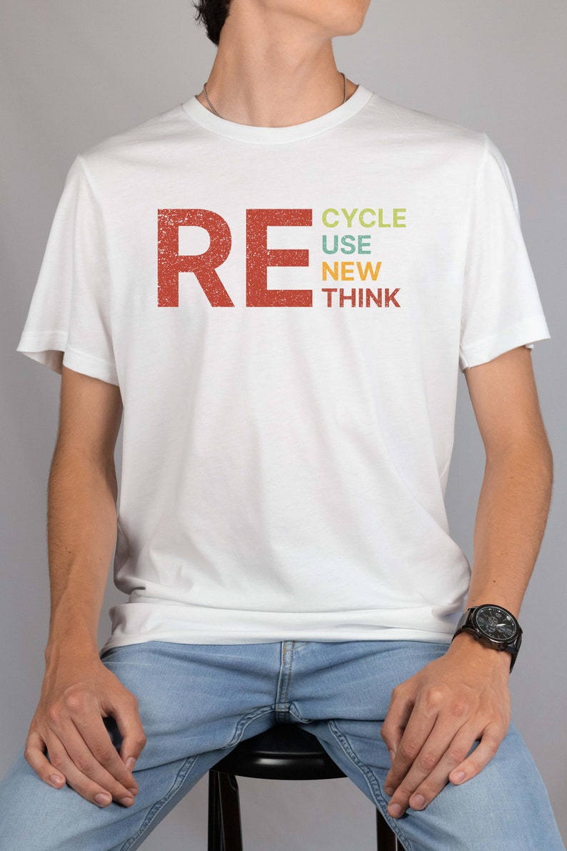 May include: A white t-shirt with a red, orange, yellow, green, and blue graphic that says "RECYCLE USE NEW THINK".