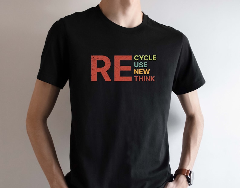 May include: A black t-shirt with the word "RE" in red, followed by the words "CYCLE", "USE", "NEW", and "THINK" stacked vertically in different colors.
