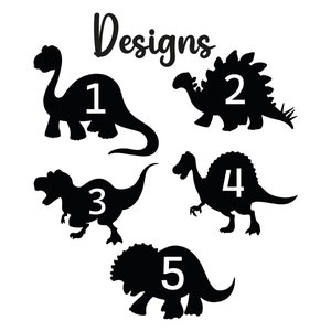 May include: Black dinosaur silhouettes numbered 1 through 5, with the word "Designs" in cursive script above. The dinosaurs are in various poses, including a Brontosaurus, Stegosaurus, and Tyrannosaurus Rex, all on a white background.