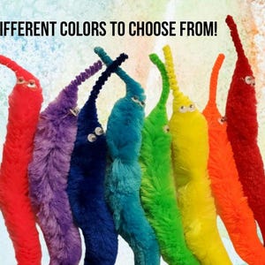 May include: A collection of colorful, fuzzy worm toys in shades of red, purple, blue, teal, green, yellow, and orange. Each worm has small, googly eyes. The text "DIFFERENT COLORS TO CHOOSE FROM!" is at the top.