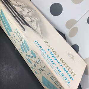 May include: A box for a Sea Witch Clipper Ship wood model kit. The box features a black and white illustration of the ship with sails. The box is blue and white with the text "Sea Witch Clipper Ship Wood Ship Model" and "Overall Length 27 1/4 Inches".