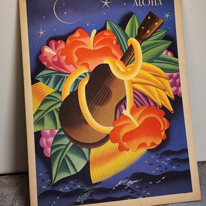 May include: A vintage postcard with a colorful illustration of a ukulele, tropical flowers, and bananas against a blue night sky with stars and a crescent moon. The text "ALOHA" is printed in white at the top of the postcard.