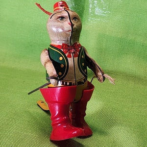windup puss n boots tin toy