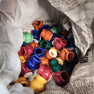 A bunch of tiny glaze sample mugs