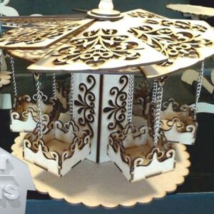 May include: A wooden carousel-style tiered serving tray with intricate cut-out designs. The tray has six individual compartments, each suspended by a silver chain. The tray is made of light wood and has a scalloped edge.