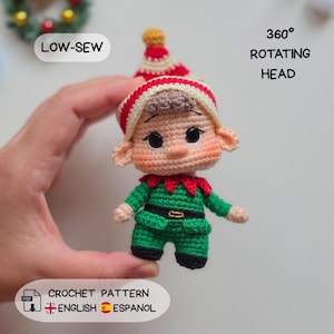 May include: A crochet elf doll featuring a red and white striped hat, brown hair, and a green outfit with a black belt. The doll has large dark eyes and pink cheeks. Text on the image reads LOW-SEW, 360 ROTATING HEAD, and CROCHET PATTERN.