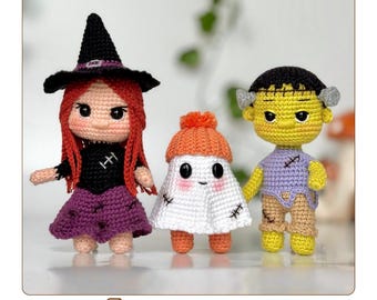 May include: Three handmade crochet Halloween figures: a witch with red hair, a ghost, and Frankenstein's monster. The witch wears a black hat and purple skirt. The ghost is white with an orange hat. Frankenstein is yellow with black hair. The image includes the text "ENGLISH CROCHET PATTERN".