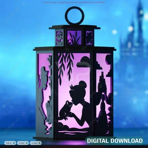 May include: A black lantern with a princess and frog silhouette design, illuminated with purple light. The lantern features cut-out details of a princess kissing a frog, with a castle backdrop. The words "DIGITAL DOWNLOAD" are at the bottom.