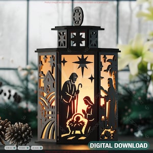 May include: Black laser-cut wooden lantern with a nativity scene design. The lantern features cut-out stars, a house, and palm trees. The scene depicts Mary, Joseph, and baby Jesus. The lantern has a decorative top and the words "DIGITAL DOWNLOAD".