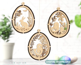May include: Three wooden Easter egg ornaments with intricate cutouts. The first ornament features a rabbit in a forest scene, the second features two birds in a floral design, and the third features a chick in a floral design.