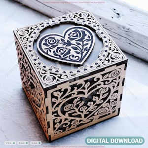 May include: A laser-cut wooden box with a heart-shaped design featuring roses. The box has intricate cut-out patterns on the sides and top, with the words "OPEN" and "CLOSE" around the heart. The words "DIGITAL DOWNLOAD" are at the bottom.