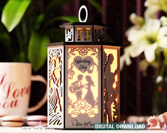 May include: A wooden lantern with a cutout design of a couple, musical notes, and the words "Wedding Day". The lantern is lit from within, casting a warm glow. The lantern is 1/8 inch thick and has a 3 mm and 4 mm measurement.