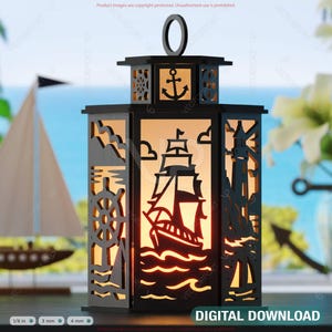 May include: A black nautical-themed lantern with cut-out designs of a ship, anchor, lighthouse, and steering wheel. The lantern has a handle and is illuminated from within, with the words "DIGITAL DOWNLOAD" at the bottom.