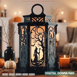 May include: A black lantern with intricate cutouts featuring a witch, a crescent moon, bats, and a haunted house. The lantern has a top handle and emits a warm glow from within. Text at the bottom reads: 1/8 in, 3 mm, 4 mm, 6 mm, 1/4 in, DIGITAL DOWNLOAD.