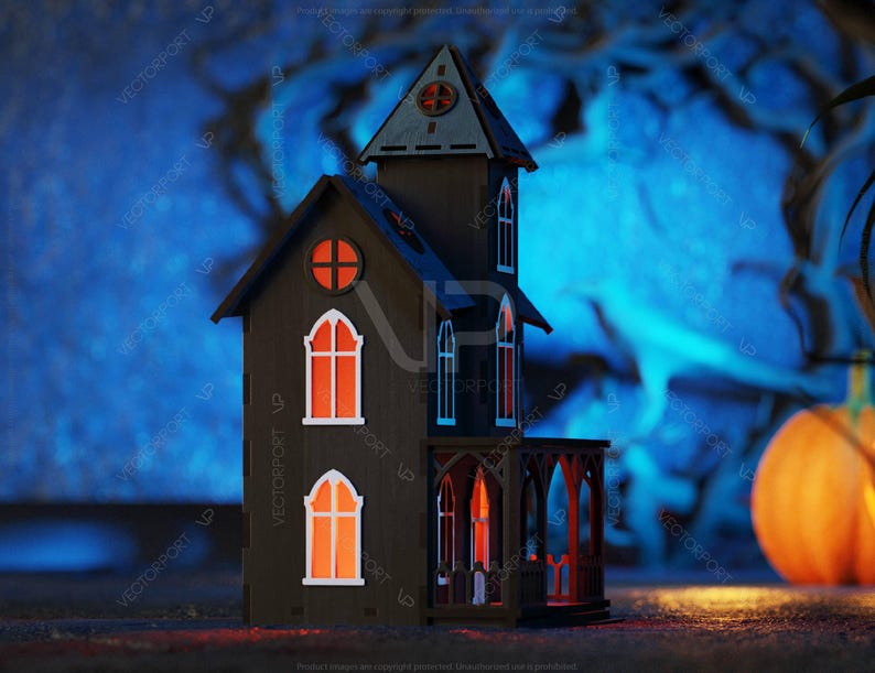 May include: A dark wooden haunted house with glowing windows sits in front of a blue and black background. A large orange pumpkin sits to the right of the house.