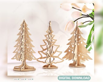 May include: Three wooden Christmas tree ornaments with intricate cut-out designs. The trees are standing on a white surface. DIGITAL DOWNLOAD