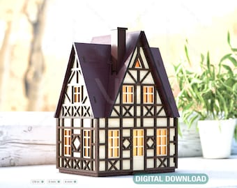 May include: A wooden model of a small house with a brown roof, white walls, and black trim. The house has a half-timbered design with windows that have a warm glow.
