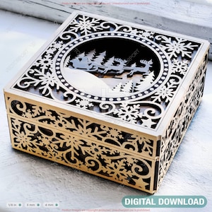 May include: A wooden box with intricate snowflake and floral cutouts. The lid features a circular design with a silhouette of Santa's sleigh and reindeer. The box is light brown with a dark interior, perfect for holiday decor. The text "DIGITAL DOWNLOAD" is visible.